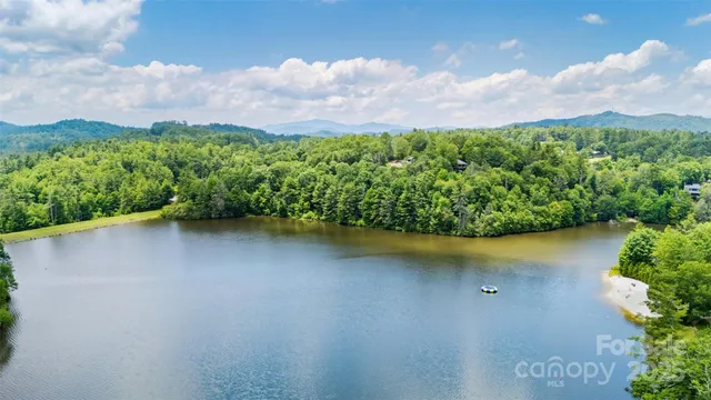 a view of a lake with a yard