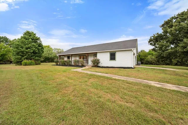 a view of house with ocean view