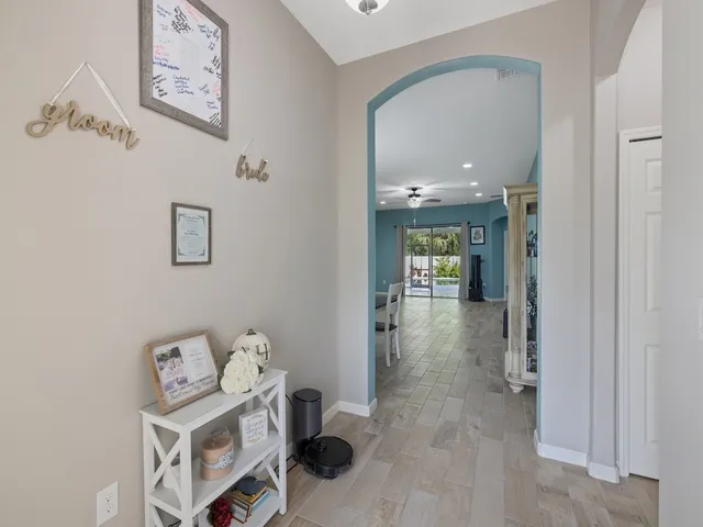 a living room with furniture and a large mirror