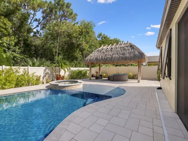 a view of a swimming pool with a patio