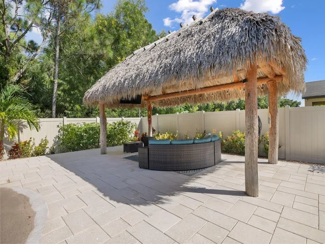 a view of a backyard with sitting area