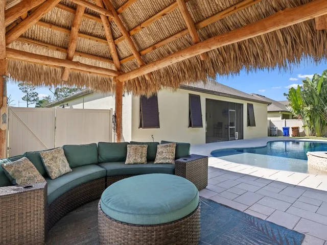 a view of a patio with couches and potted plants