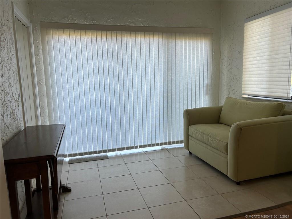 5355 Southeast Miles Grant Road, Unit E114 Stuart, FL 34997 - Photo 4 of 15 enclosed porch