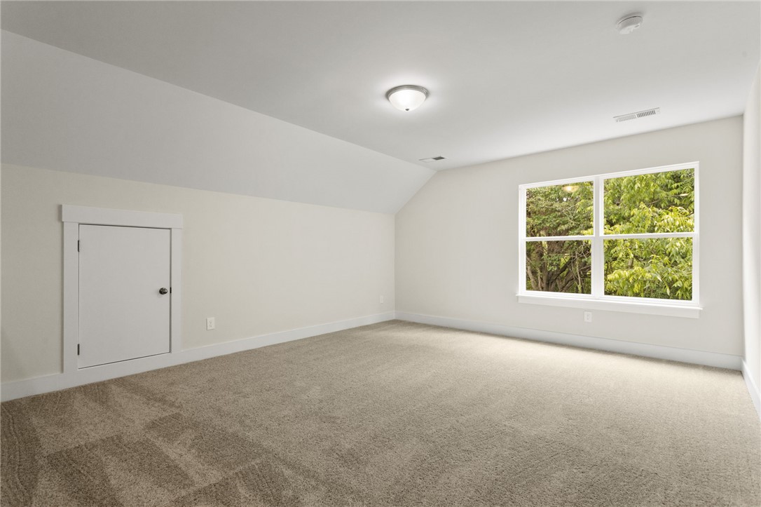 315 Old Shirley Road Central, SC 29630 - Photo 22 of 26 This airy bedroom offers a serene retreat with soft carpeting and ample natural light.