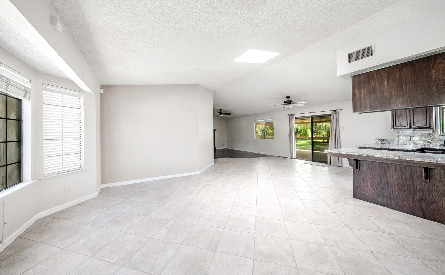 12502 Road 37 1/2 Madera, CA 93636 - Photo 11 of 79 a view of a kitchen with a sink and a stove top oven