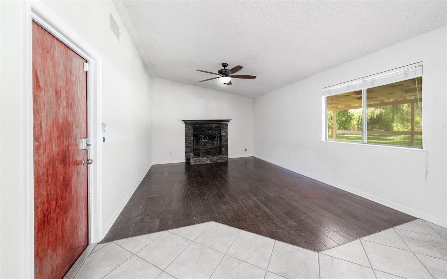 12502 Road 37 1/2 Madera, CA 93636 - Photo 13 of 79 wooden floor in an empty room with a window