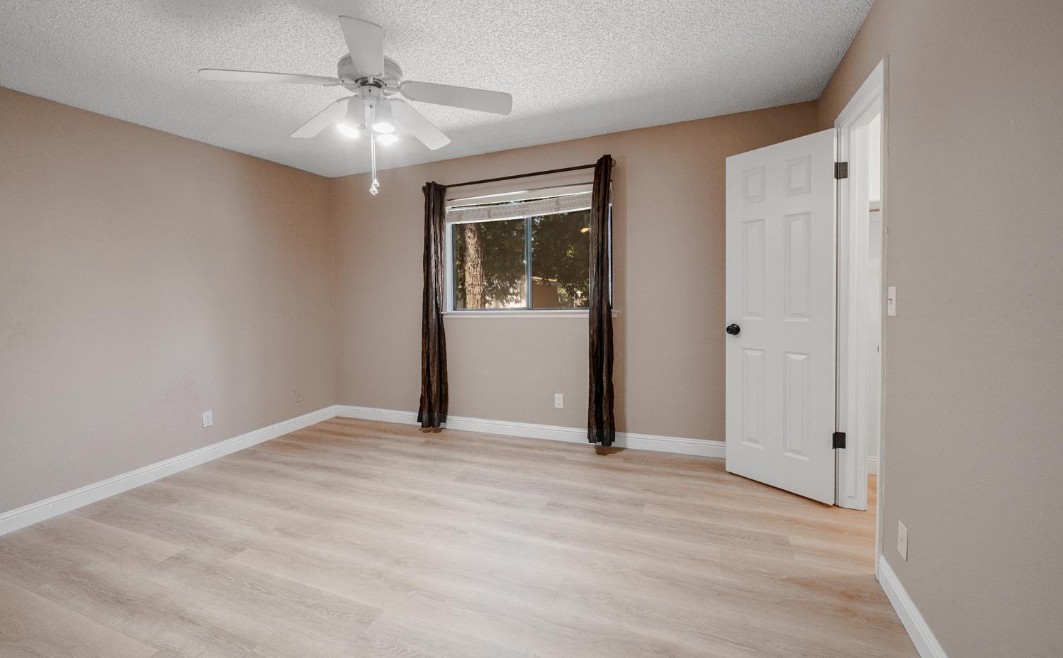 12502 Road 37 1/2 Madera, CA 93636 - Photo 25 of 79 a view of an empty room with closet and a window