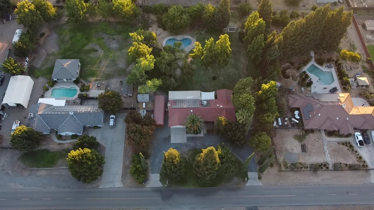 12502 Road 37 1/2 Madera, CA 93636 - Photo 3 of 79 an aerial view of a house with a garden