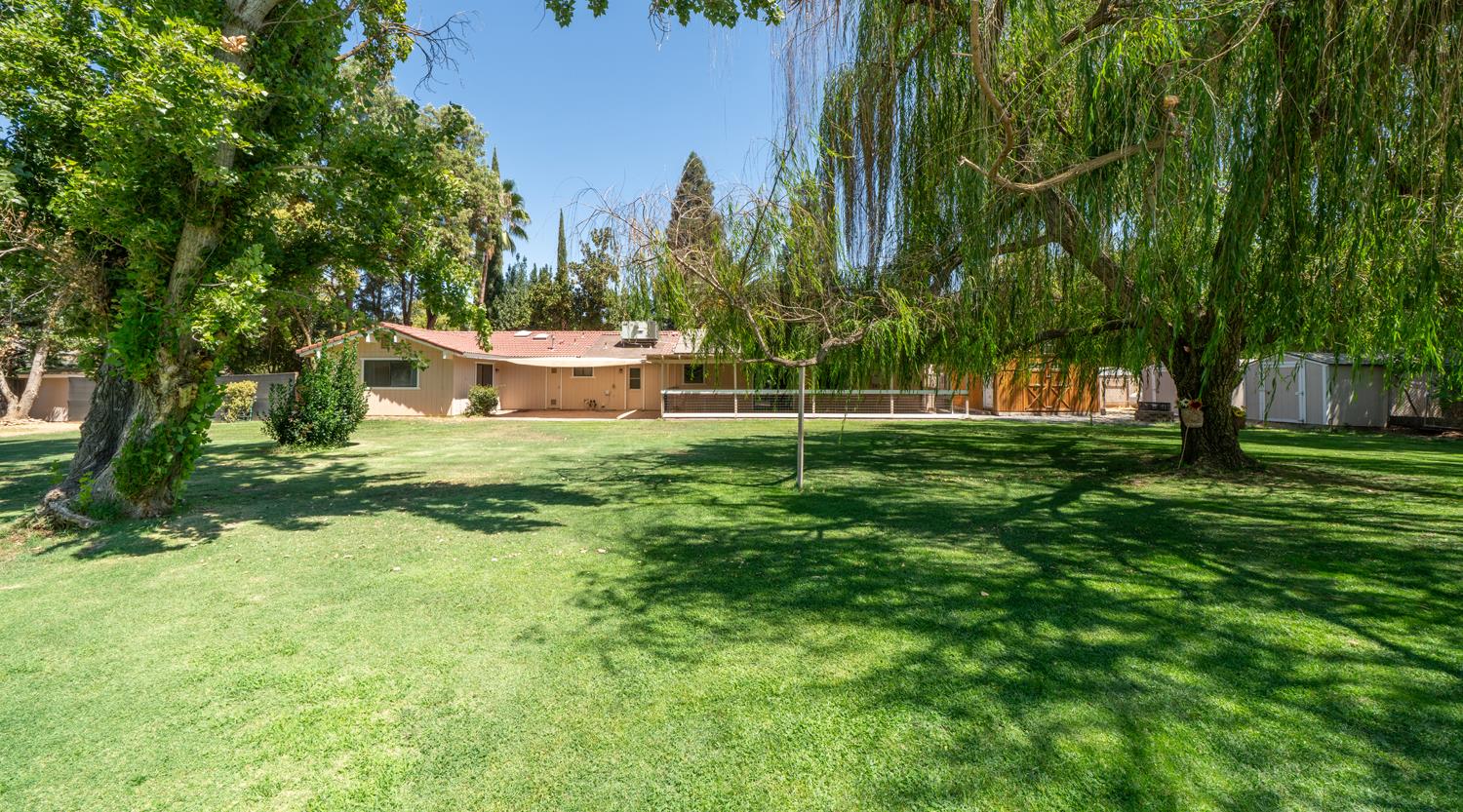 12502 Road 37 1/2 Madera, CA 93636 - Photo 51 of 79 a view of a house with a yard