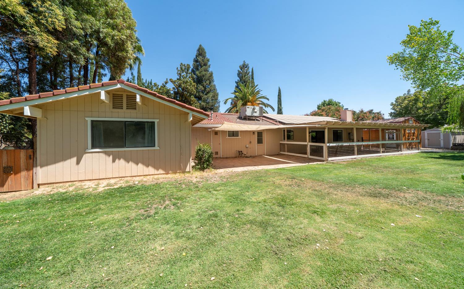 12502 Road 37 1/2 Madera, CA 93636 - Photo 52 of 79 a front view of a house with a yard