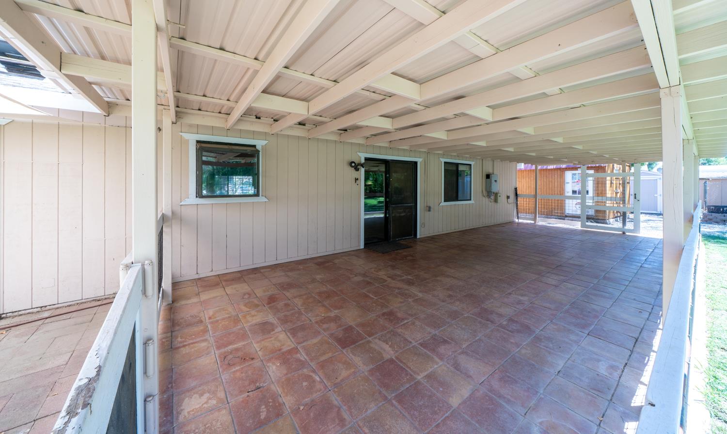 12502 Road 37 1/2 Madera, CA 93636 - Photo 55 of 79 a view of an empty room with wooden floor and a window