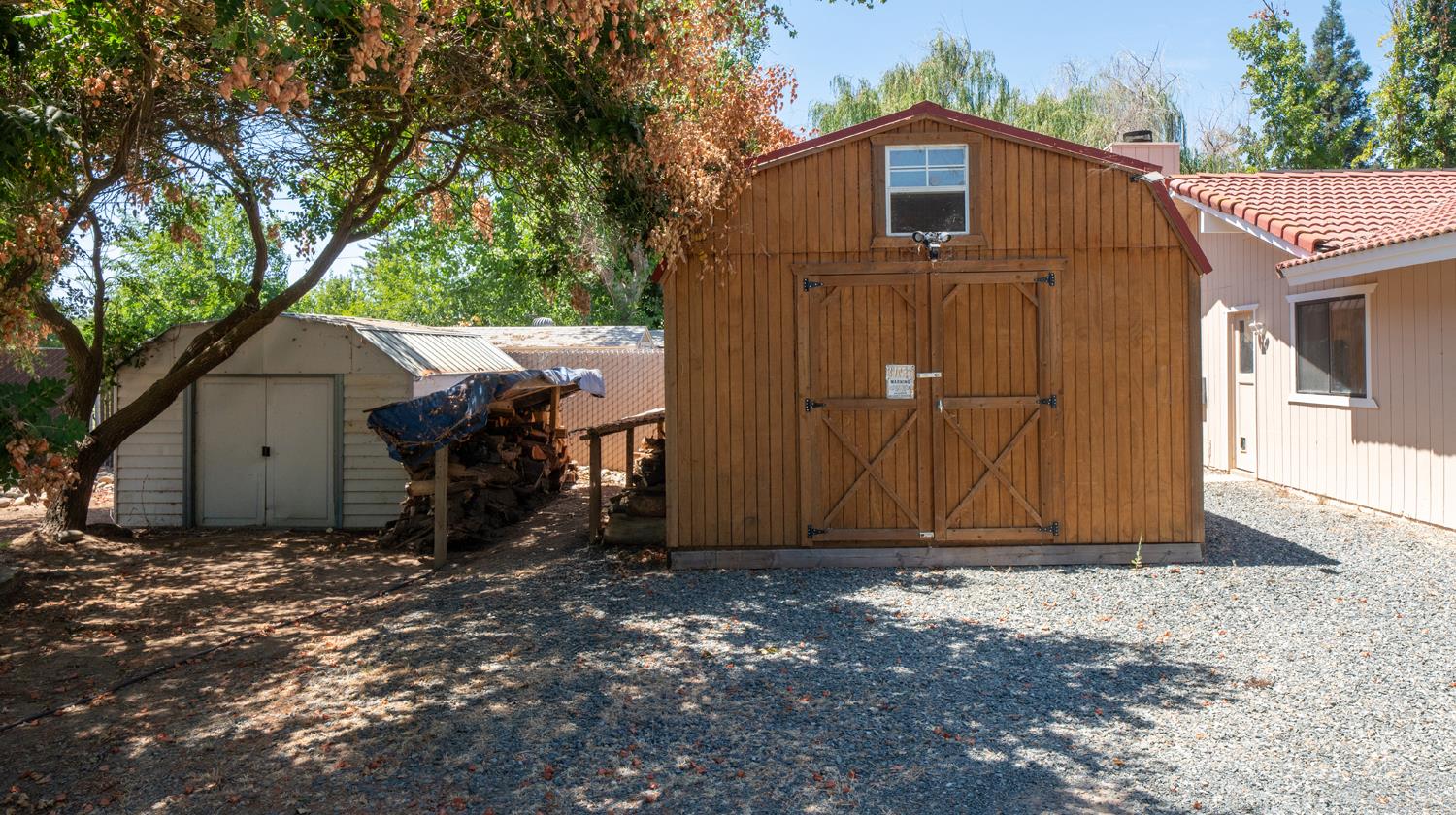 12502 Road 37 1/2 Madera, CA 93636 - Photo 8 of 79 a front view of a house with a yard