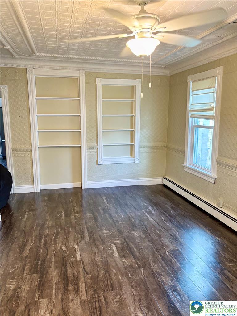 7241 Decatur Street New Tripoli, PA 18066 - Photo 6 of 36 Well-lit room featuring rich flooring and integrated ceiling fan, perfect for relaxation or study.