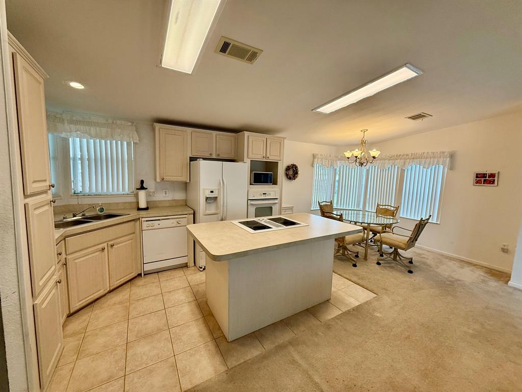 2080 Southwest 85th Avenue Davie, FL 33324 - Photo 3 of 13 a kitchen with a sink a counter top space and appliances