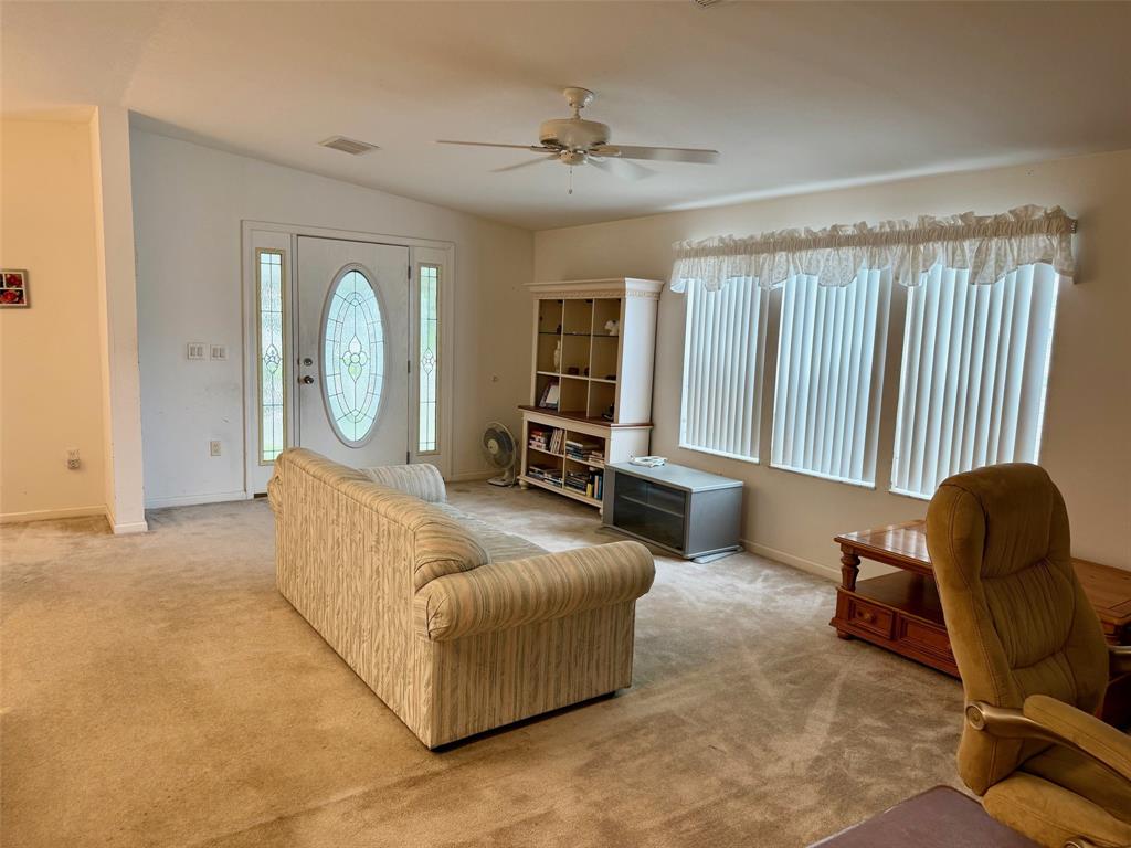 2080 Southwest 85th Avenue Davie, FL 33324 - Photo 5 of 13 a living room with furniture fireplace and a large window