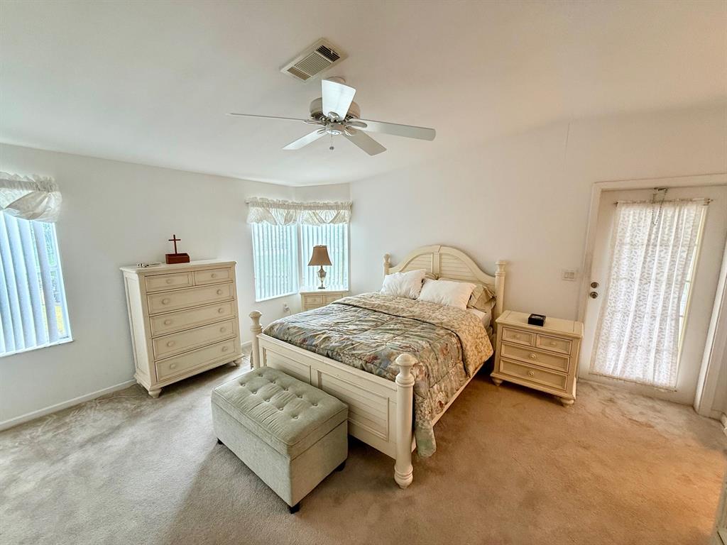 2080 Southwest 85th Avenue Davie, FL 33324 - Photo 6 of 13 a bedroom with a bed a couch and dresser