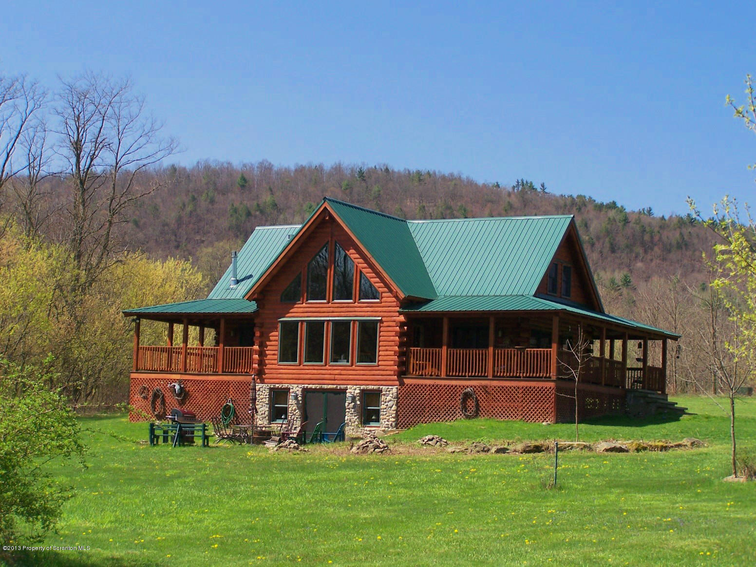 front view of a house with a big yard
