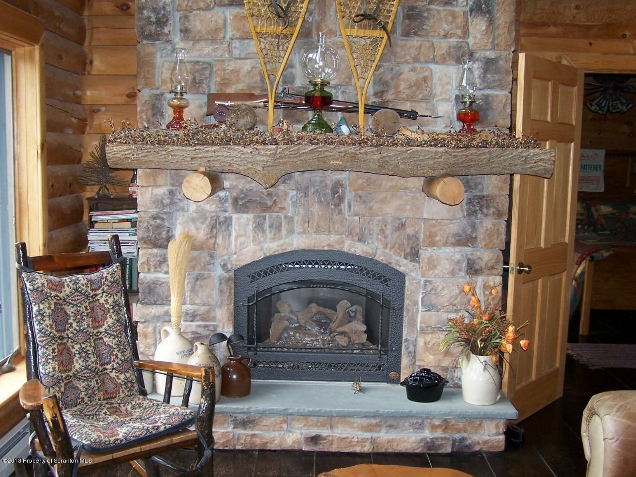 98 Detrick Road Sugar Run, PA 18846 - Photo 11 of 48 a living room with fireplace furniture and a fireplace