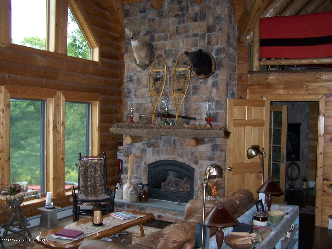 98 Detrick Road Sugar Run, PA 18846 - Photo 13 of 48 a living room with furniture and a fireplace