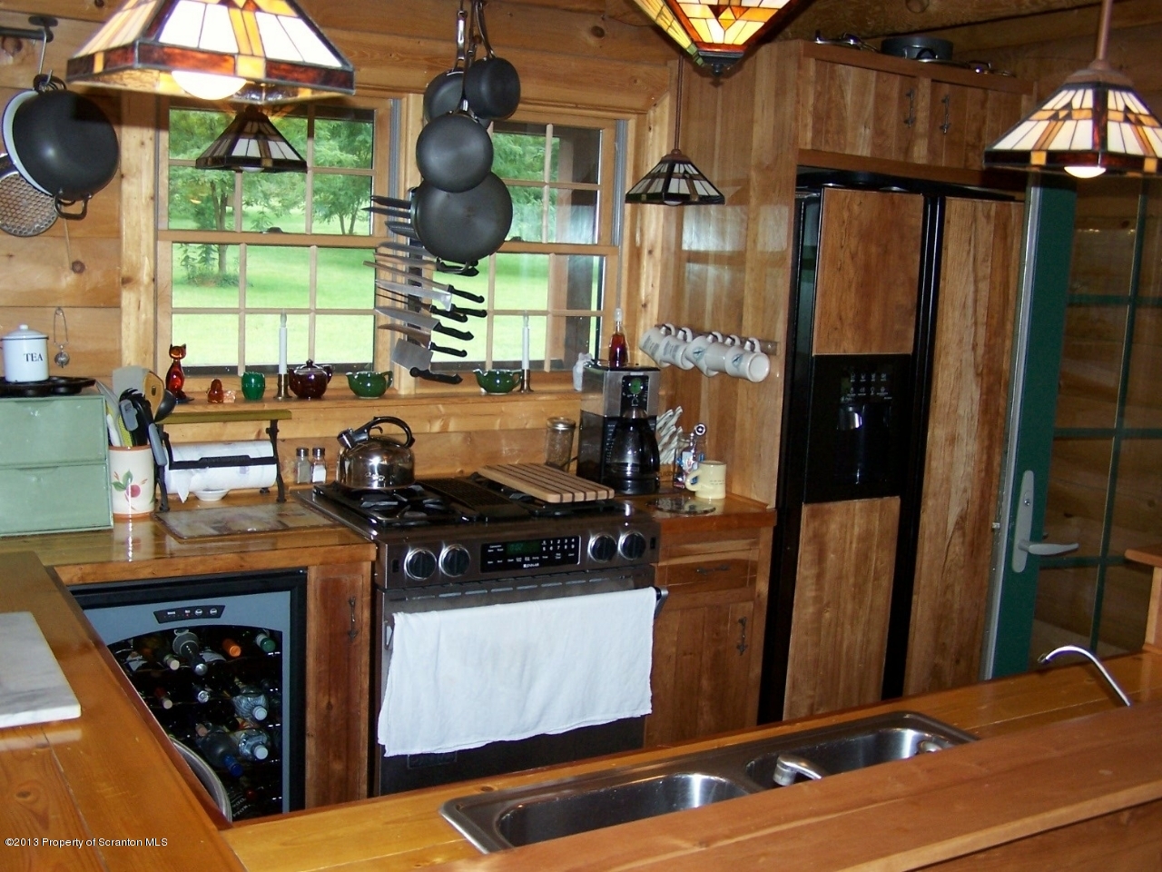 98 Detrick Road Sugar Run, PA 18846 - Photo 18 of 48 a kitchen with stainless steel appliances granite countertop a stove and a refrigerator