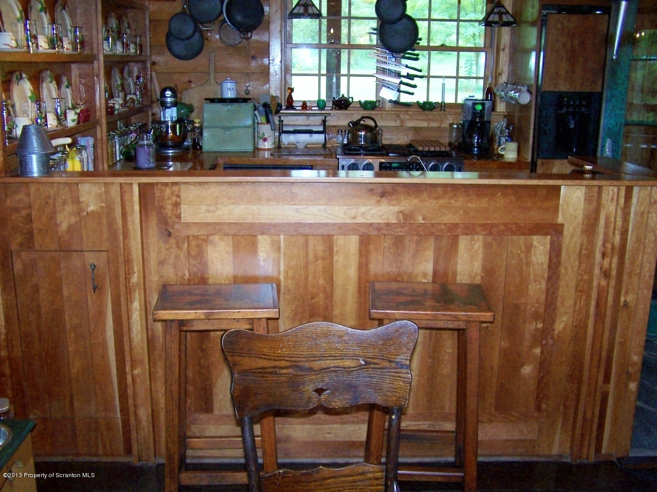 98 Detrick Road Sugar Run, PA 18846 - Photo 19 of 48 a dining table with chairs and wooden floor