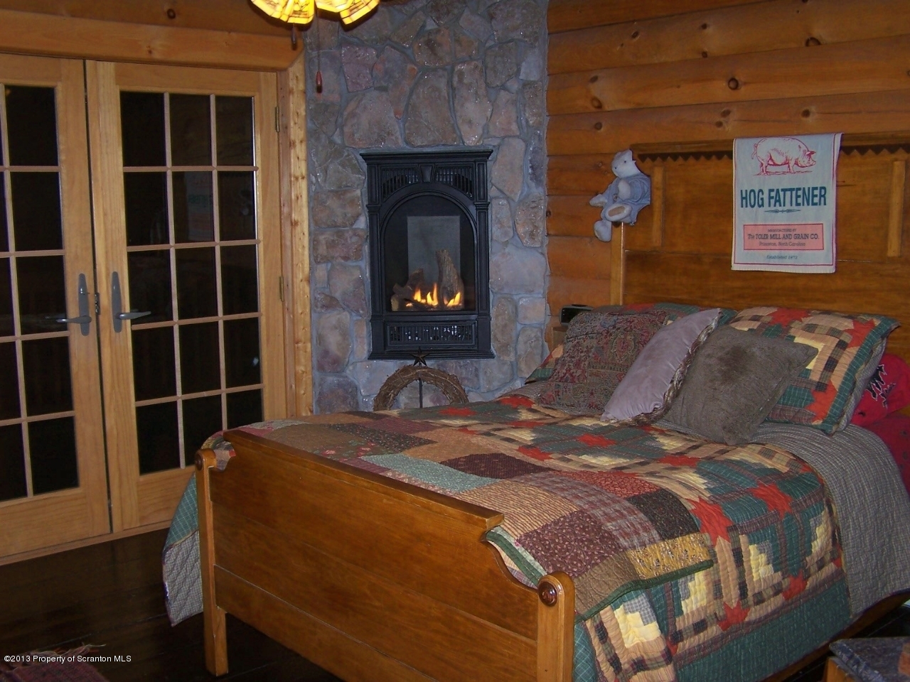 98 Detrick Road Sugar Run, PA 18846 - Photo 23 of 48 a bedroom with a bed and a fireplace