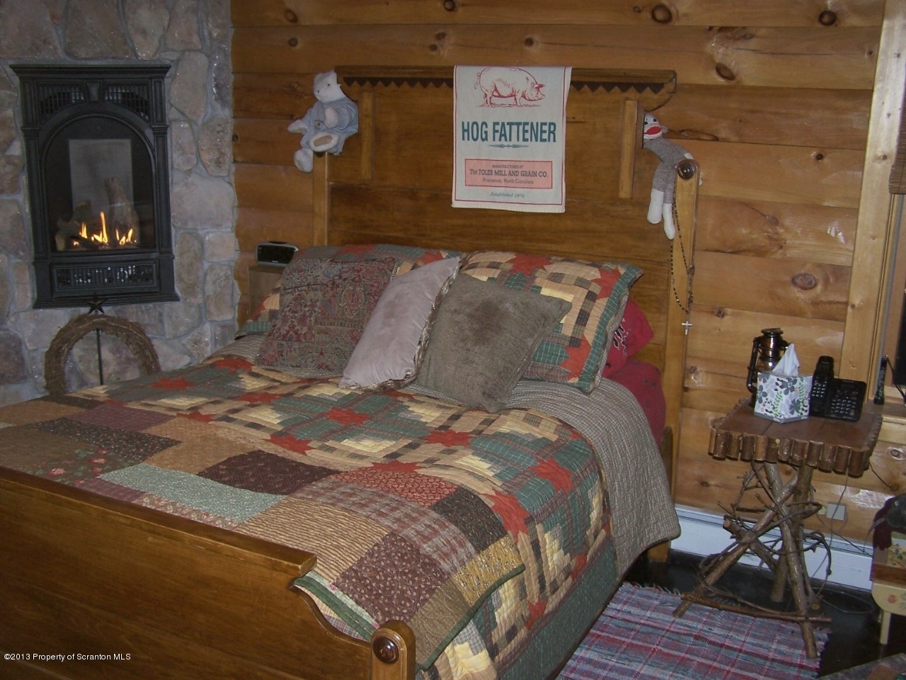 98 Detrick Road Sugar Run, PA 18846 - Photo 24 of 48 a bedroom with a bed and wooden floor