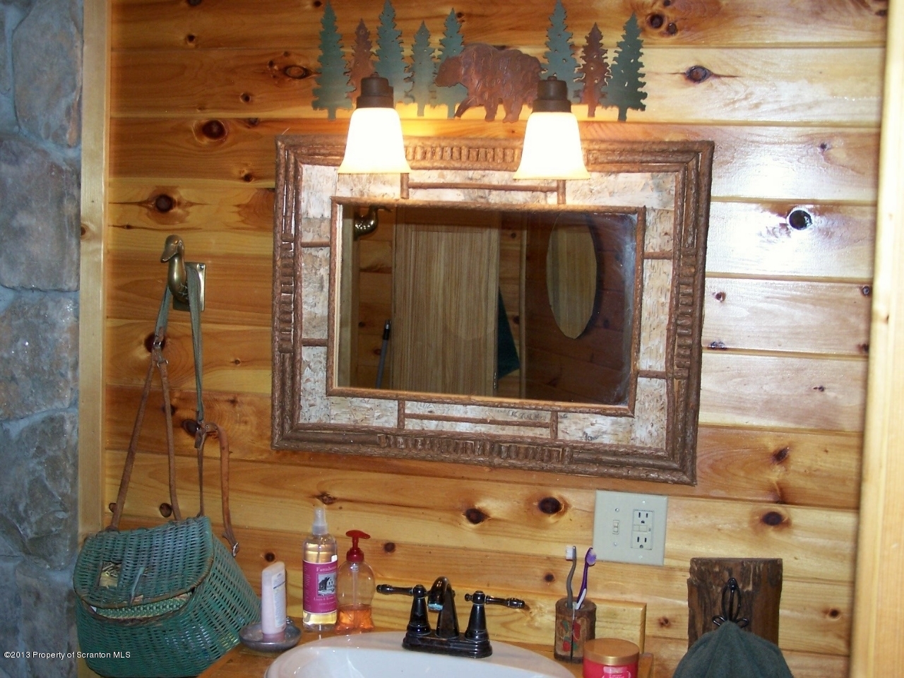 98 Detrick Road Sugar Run, PA 18846 - Photo 26 of 48 a bathroom with a sink and a mirror