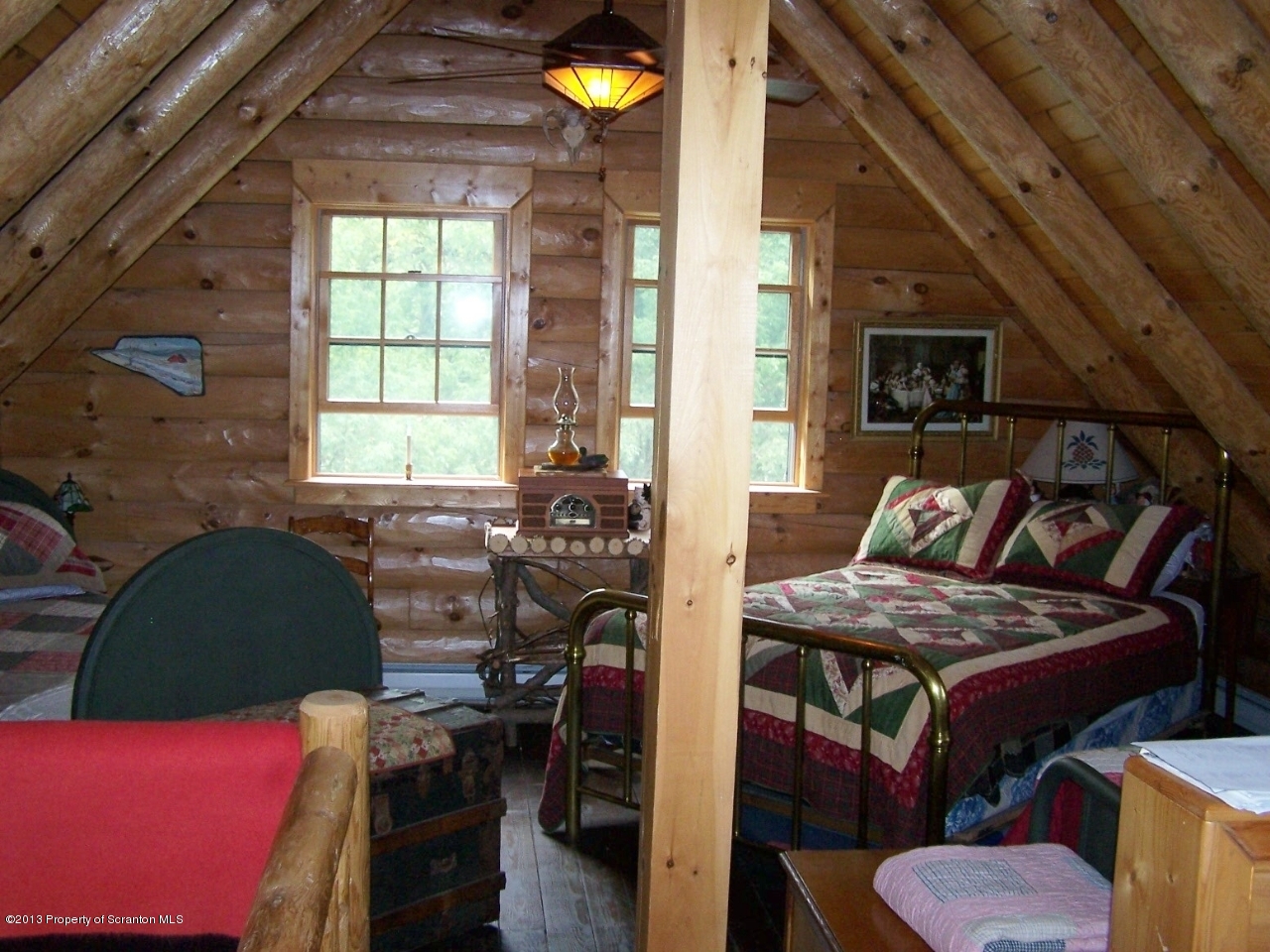 98 Detrick Road Sugar Run, PA 18846 - Photo 30 of 48 a view of a livingroom with furniture and a window