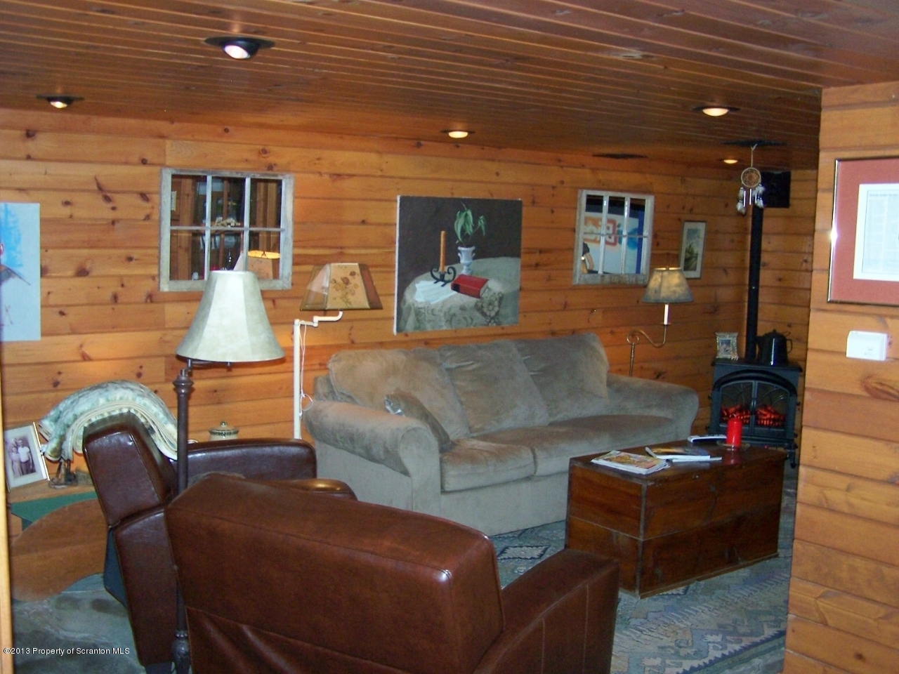 98 Detrick Road Sugar Run, PA 18846 - Photo 36 of 48 a living room with furniture and a flat screen tv
