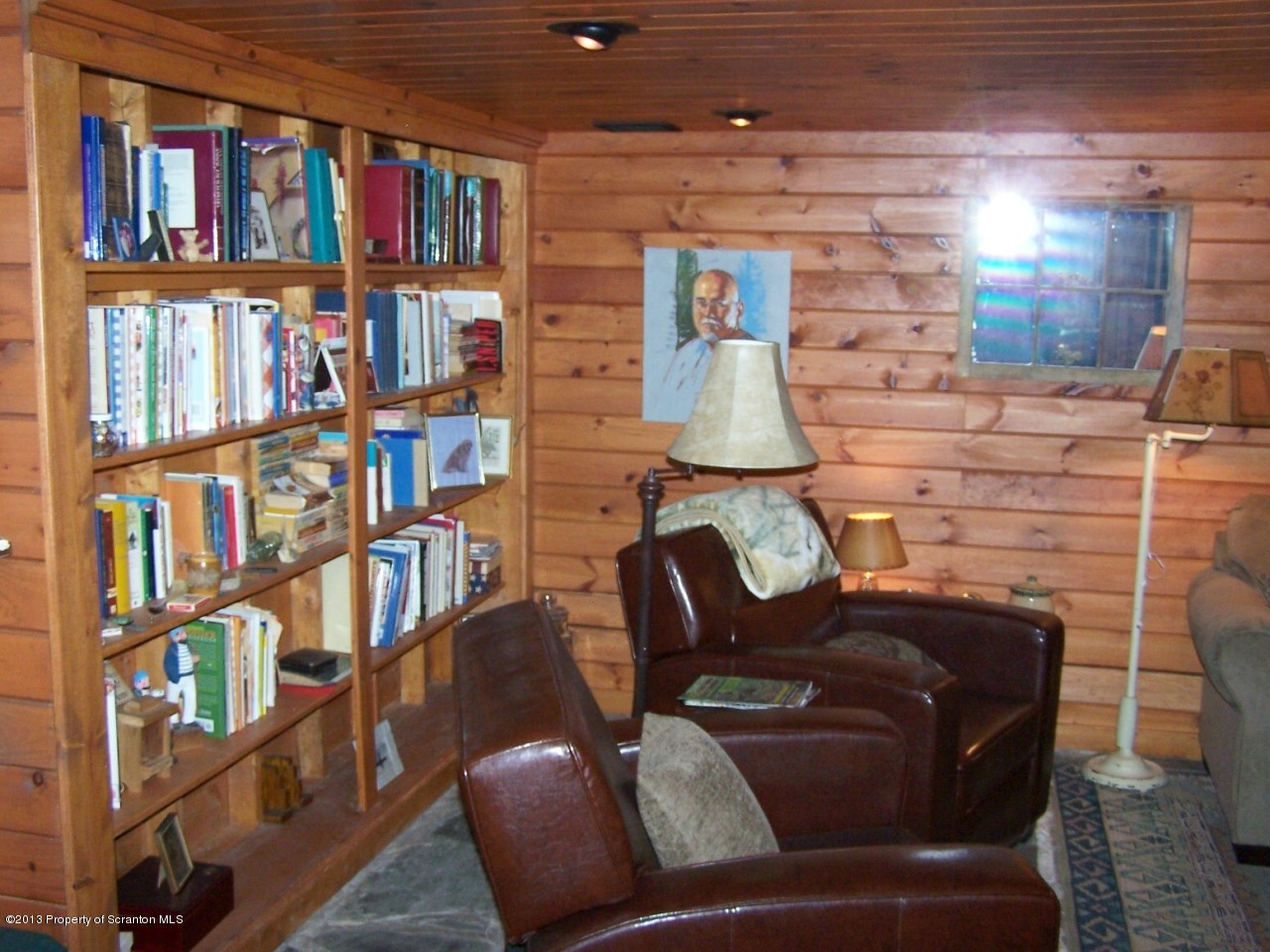 98 Detrick Road Sugar Run, PA 18846 - Photo 38 of 48 a living room with furniture and a book shelf