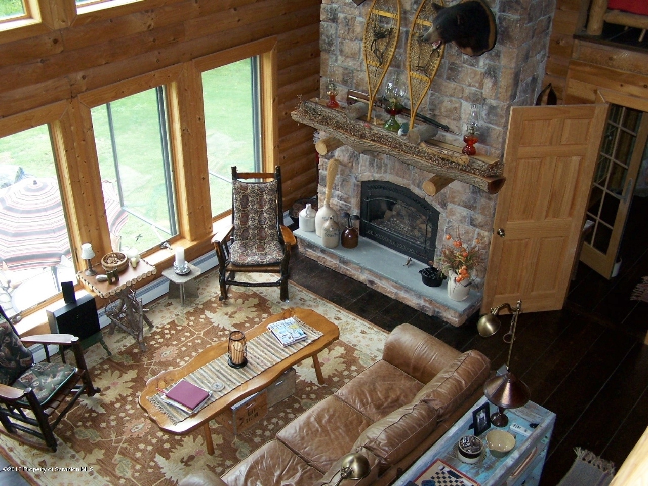 98 Detrick Road Sugar Run, PA 18846 - Photo 9 of 48 a living room with furniture and a fireplace