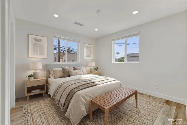 a bedroom with a large bed and a window