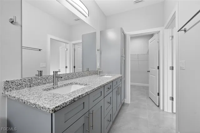 a view of an empty room and a ceiling fan