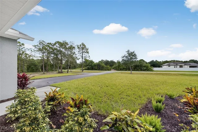 a view of a lake with a yard