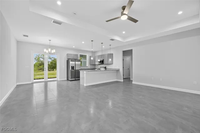 a view of a kitchen with a sink and a window
