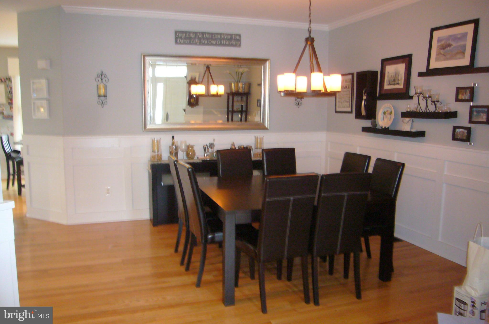 Custom trim work in bright and open dining room