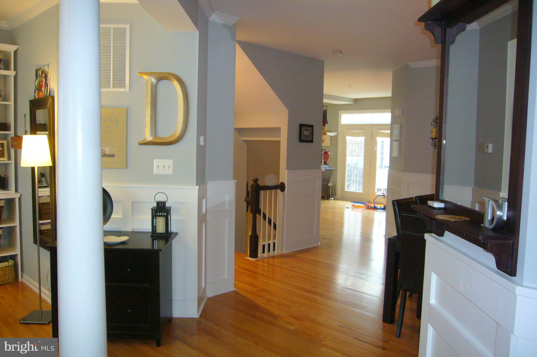 Bright & Open entrance way with hardwood