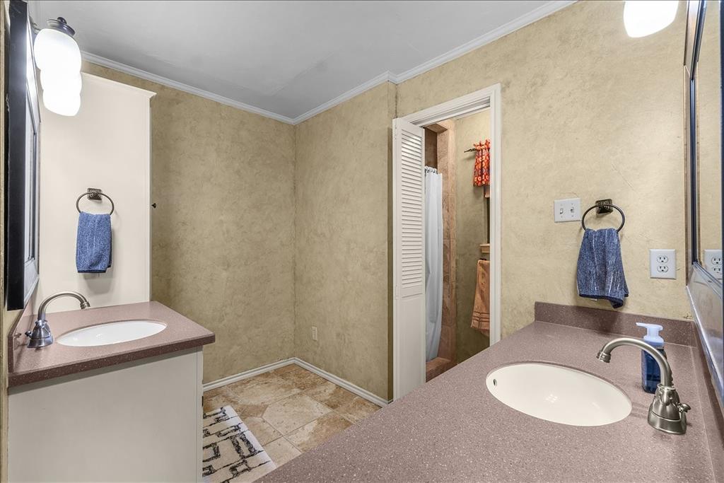 220 Annetta Road Willow Park, TX 76087 - Photo 15 of 40 a bathroom with a sink and a mirror