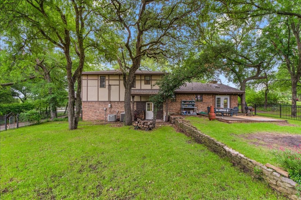 220 Annetta Road Willow Park, TX 76087 - Photo 33 of 40 a view of a house with backyard and a tree