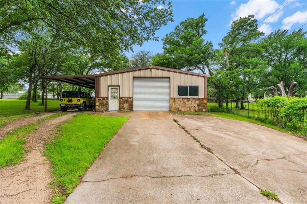 220 Annetta Road Willow Park, TX 76087 - Photo 34 of 40 a front view of a house with a yard and trees