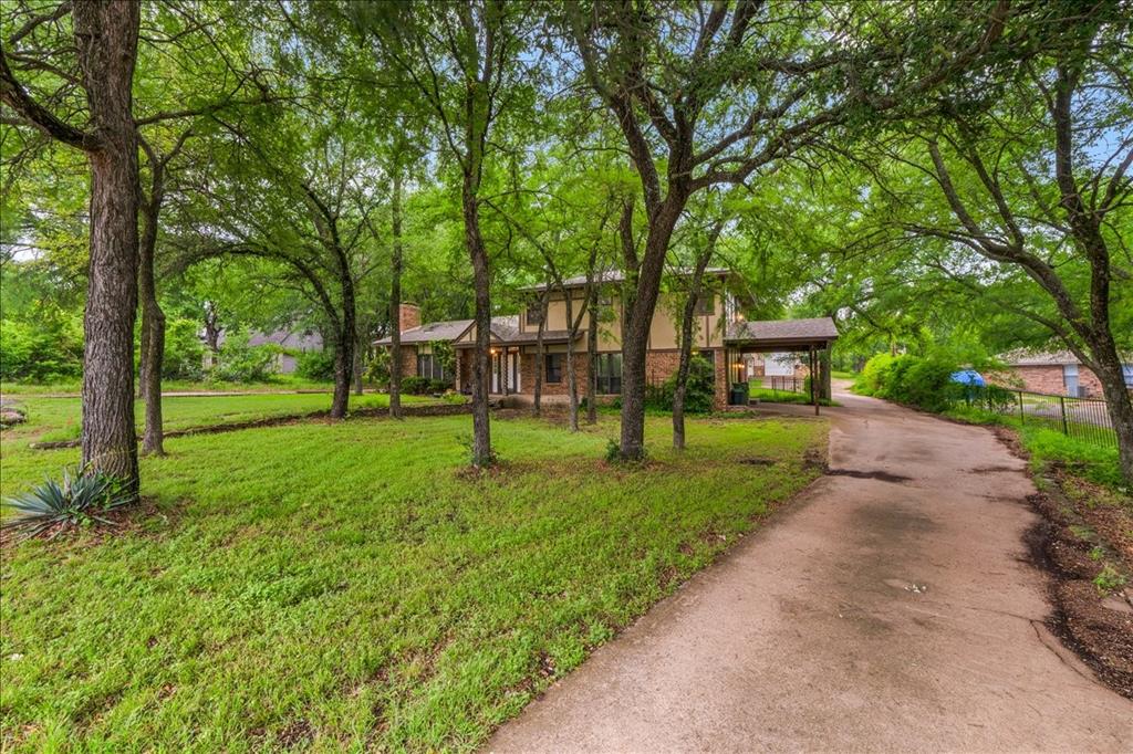 220 Annetta Road Willow Park, TX 76087 - Photo 4 of 40 a view of a park with trees and wooden fence