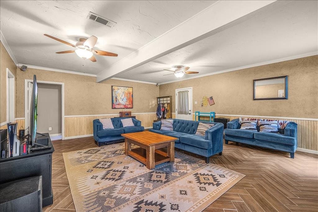 220 Annetta Road Willow Park, TX 76087 - Photo 6 of 40 a living room with furniture a rug and a chandelier