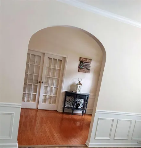 a view of a workspace with wooden floor