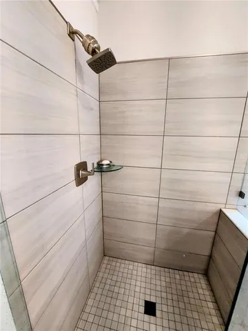 a room with a sink a vanity and mirror