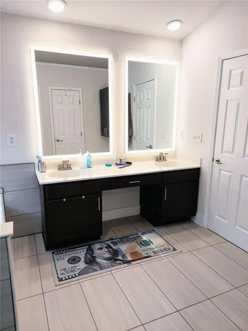 a bathroom with a bathtub and a window