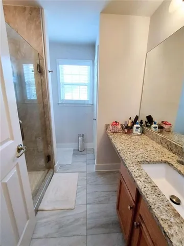 a bathroom with a bathtub and shower