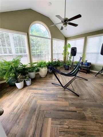 a room with furniture and a large window