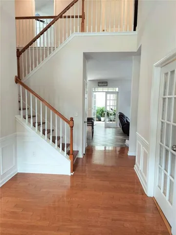 a view of workspace with furniture and wooden floor