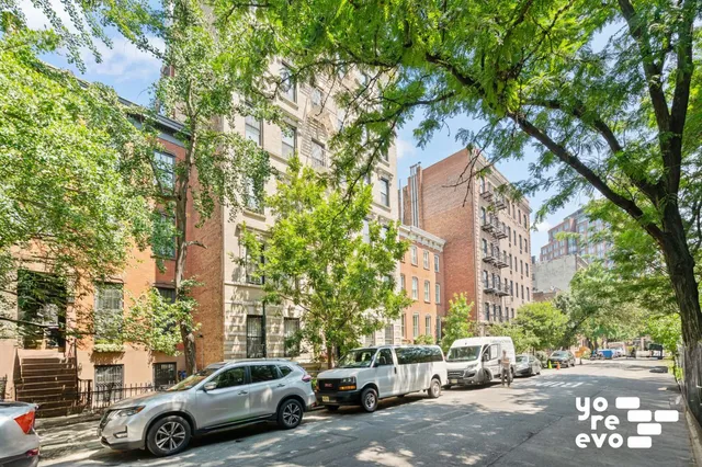 a bathroom with a shower a toilet and sink